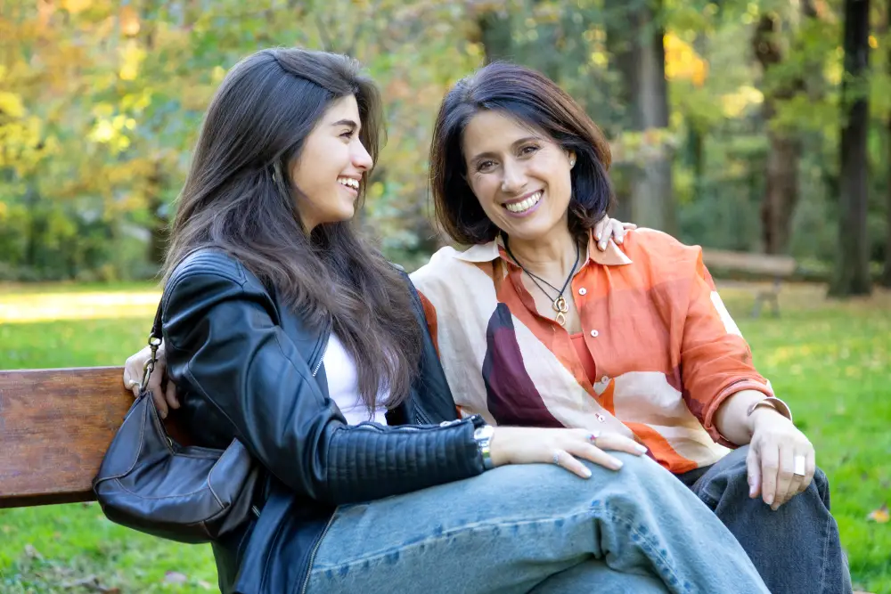 Older woman in orange shirt participating in a rehab program for women and kids in orange county.