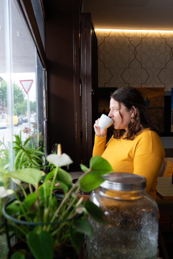 Woman in anaheim getting coffee during break at her outpatient rehab in anaheim.