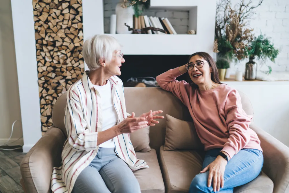 older women sitting on a couch in a sober living in anaheim.