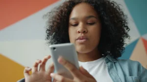 Woman looking at her phone, accompanying an alcohol and anxiety self-check
